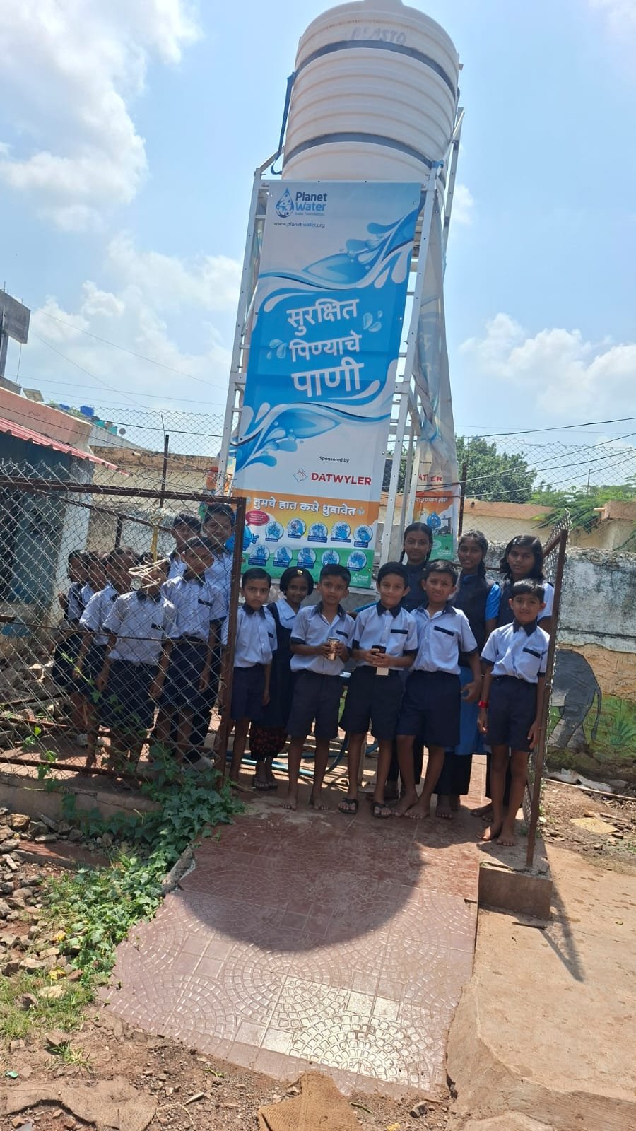 Students at the school drinking water facility